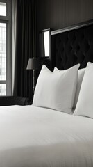 Elegant bedroom with plush white bedding and modern decor in a chic urban hotel setting
