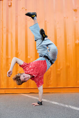 Performing Energetic Breakdance Move Outdoors