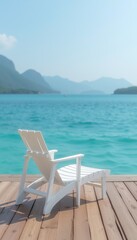 Fototapeta premium Serene White Lounge Chair on Wooden Deck Overlooking Turquoise Waters with Mountain Backdrop