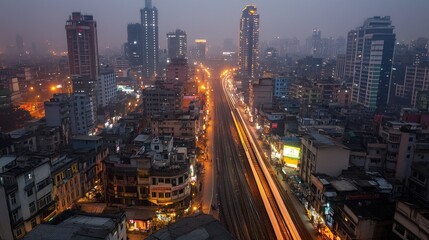 Fototapeta premium Night city train tracks aerial view, urban lights blur, fog