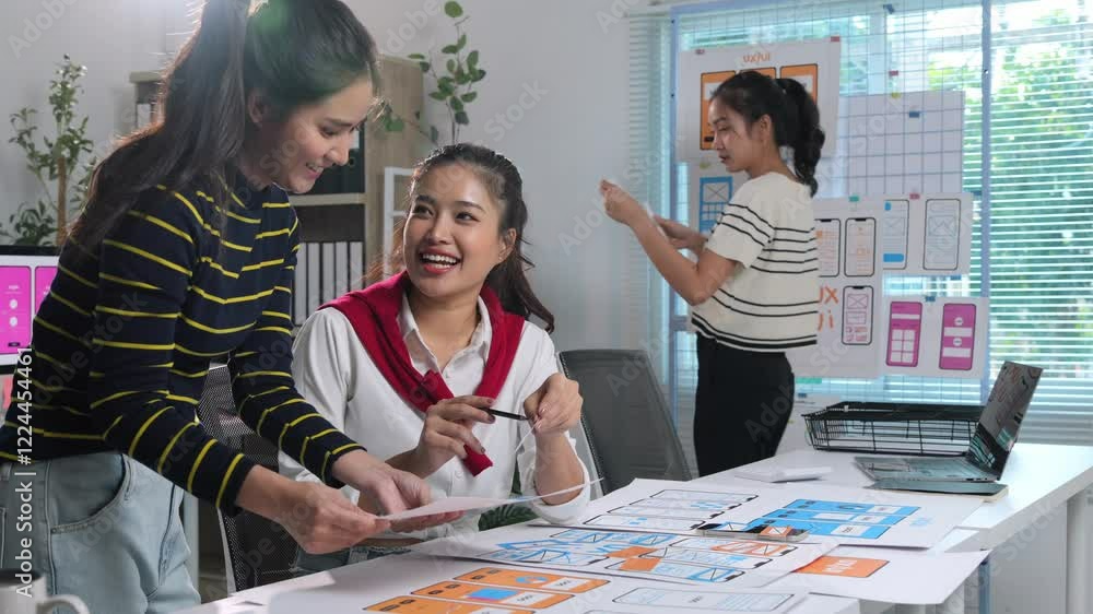 Poster professional asian women designers collaborating on mobile application user interface and user exper
