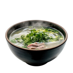 steaming bowl of pho with fresh herbs and meat