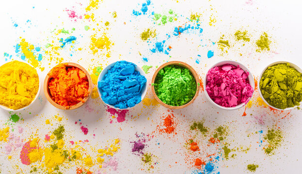 Happy Holi decoration, the indian festival.Top view of colorful holi powder on white background.