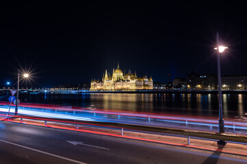Fototapeta premium View of the Parliament of Hungary, Budapest, illuminated at night across the Danube river