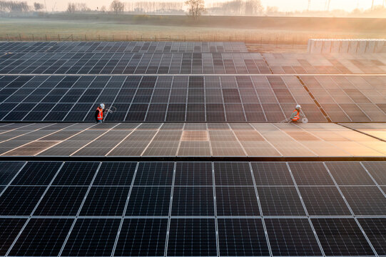 Two workers in a solar park.