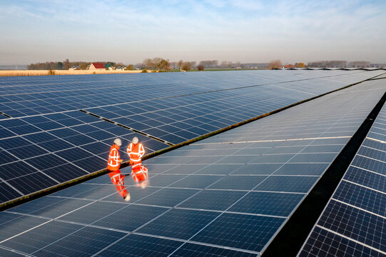 Two workers in a solar park.