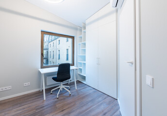Modern Minimalist Home Office Interior with White Furniture and Wooden Flooring