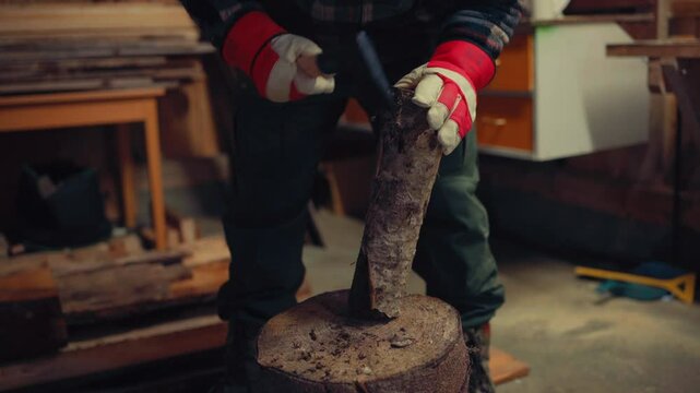 A Man With An Axe Removes Bark From Log. Close-up Shot