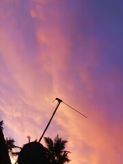 The different colors that appear im the sky during sunset ( Orange,pink,purple).
