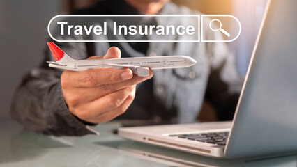 Businessman searching for air travel insurance online