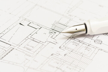 fountain pen and blueprint of the new apartment for build architectural construction house building. architect studio.