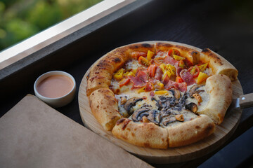 hot home made pizza ready for serve on table.