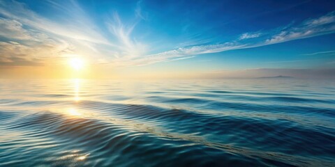 Obraz premium A serene and peaceful ocean scene with subtle sea ripples caused by the gentle morning breeze and sunlight filtering through the misty air , soft light, gentle waves