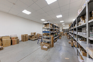 Order Amidst Chaos A Well-Lit Storage Haven of Metal Shelves and Untold Possibilities