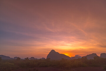 colorful sky at sunrise over Samet Nang Chee viewpoint..Amazing light of nature cloudscape sky...