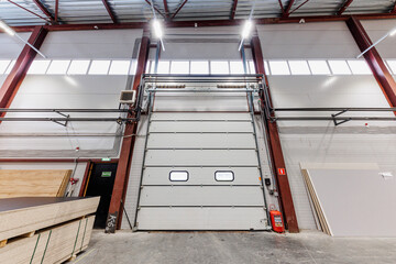 Obraz premium Hidden Potential A Silent Warehouse Filled with Stacked Materials Awaits Transformation
