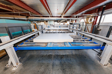 Engineering Excellence A Powerful Industrial Machine in Motion, Showcasing Metal Beams and Conveyors Designed for Precision Manufacturing.