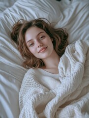 Fototapeta premium Young Woman Laying on Bed