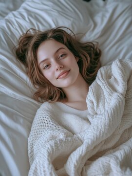 Young Woman Laying on Bed
