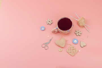 A cup of fragrant hibiscus tea and cute handmade decor. Good mood concept, cozy home comfort