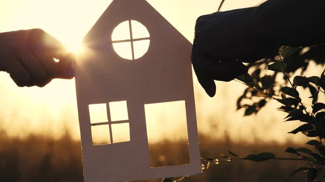 cardboard cutouts house, mortgage lifestyle business, happiness concept, holding paper house sunset, construction lifestyle concept, dream house, happy family holding paper house hands, buying a new