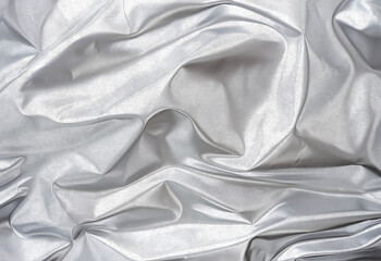 Obraz premium Fondo de papel de aluminio arrugado plateado. Rollos de papel de aluminio arrugado.