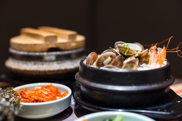 Traditional Korean seafood soup with side dishes