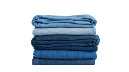 Stack of folded blue denim jeans on a wooden surface for casual fashion display