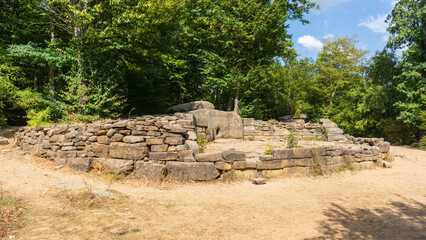 Archaeological site of dolmen or ancient burial and cult structure is located in the forest. Stone structure consists of large, carefully stacked stones with round hole in center. Gelendzhik 2014
