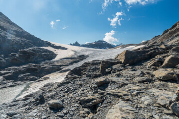 Small Rochemelon glacier near Col de la Resta mountain pass bellow Rocciamelone mountain peak in...