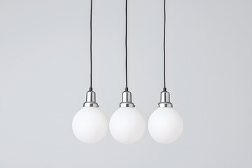 Modern chandelier with a cluster of hanging white glass orbs isolated on white background