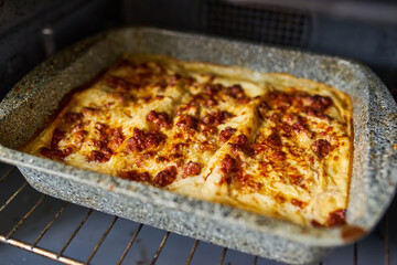 Lasagna Baking in Oven
