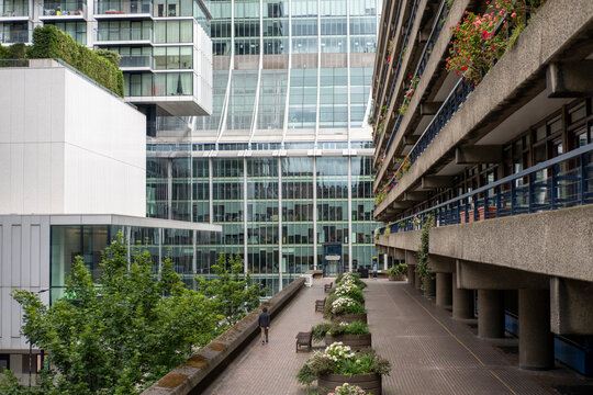 A close view of the Barbican Estate in London, showcasing its striking brutalist architecture. This iconic landmark merges raw concrete design with thoughtful urban green spaces