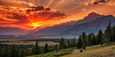 Fiery Sunset Landscape: Dramatic Sunburst Over Majestic Mountains