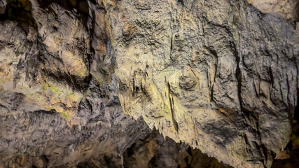 Rugged cave interior showcasing natural rock formations, ideal for concepts of exploration, geology, and adventure tourism