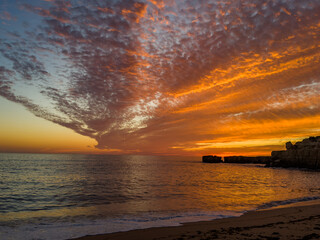 Fiery Sunset Over the Algarve Coastline in Portugal
