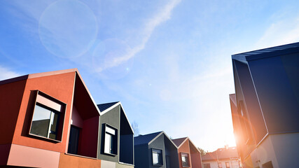Terraced family homes in newly developed housing estate. The real estate market in the suburbs. New...