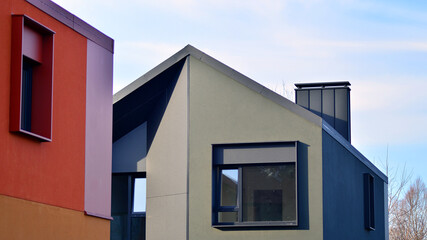 Terraced family homes in newly developed housing estate. The real estate market in the suburbs. New...