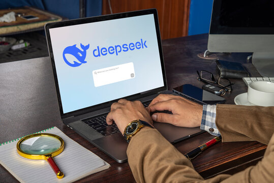 Professional working on Chinese based AI software deepseek in office