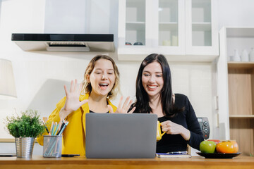 Office worker lifestyle people, Happy smiling two woman sitting in the kitchen, feel happy successful work complete Teamwork success.