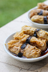 tofu skin roll with soy sauce. Filled with minced meat, vegetables, or seafood