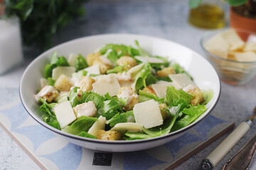 A bowl with classic Caesar salad	