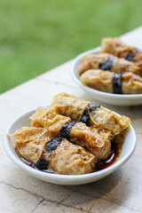 tofu skin roll with soy sauce. Filled with minced meat, vegetables, or seafood