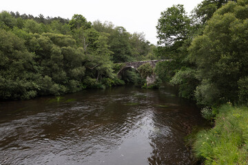 Obraz premium Medieval bridge of San Alberte and the Parga river in Guitiriz. Camino de Santiago. Xacobeo