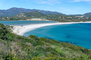 Obraz premium Porto Giunco ​​beach, with white sand and crystal clear water. Porto Giunco ​​beach and tower in Villasimius, Sardinia, Italy
