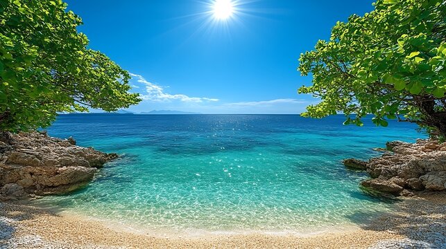 A relaxing hammock between two palm trees with clear turquoise waters and a bright sunny sky.