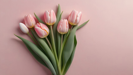 Naklejka premium Beautiful bouquet of pink and white tulips arranged on a soft pink background for a spring celebration or decor
