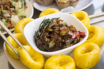 Pumpkin steamed buns with pickled vegetables