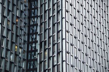Hamburg, Germany - September 10, 2024: Facade wall made of glass and metal. Commercial building. Abstract modern business architecture