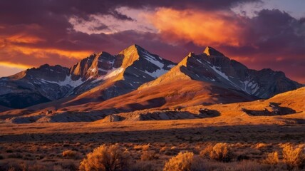 Golden Mountain Peaks at Sunset with Fiery Sky Creating a Dramatic Landscape